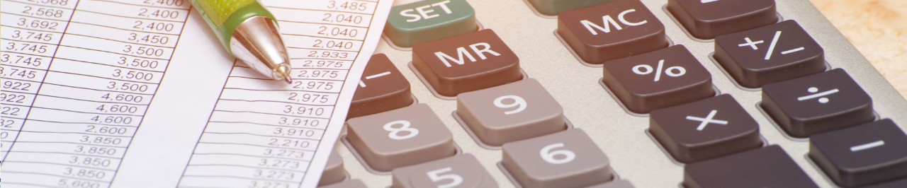 Calculator, and a pen laying on a piece of paper with numbers