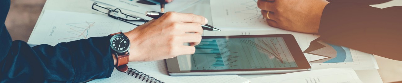 People discussing charts on the desk